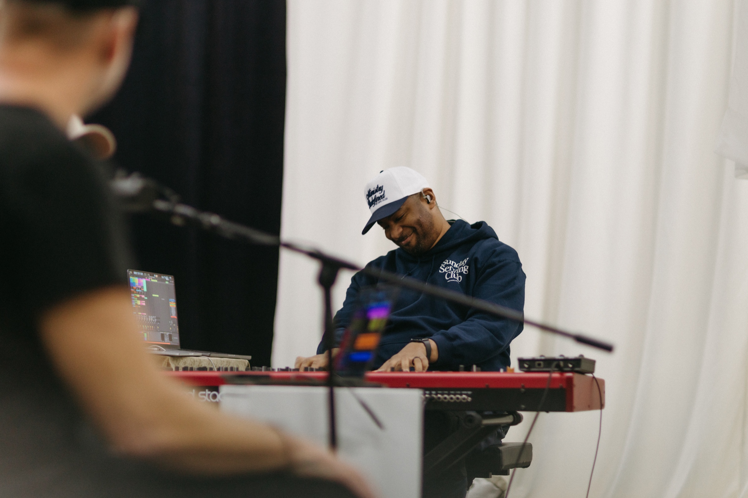 Marlon Robertson playing keyboard during a live recording session